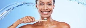 Dental, water and black woman with toothbrush, clean breath and health for teeth and gums, hygiene .
